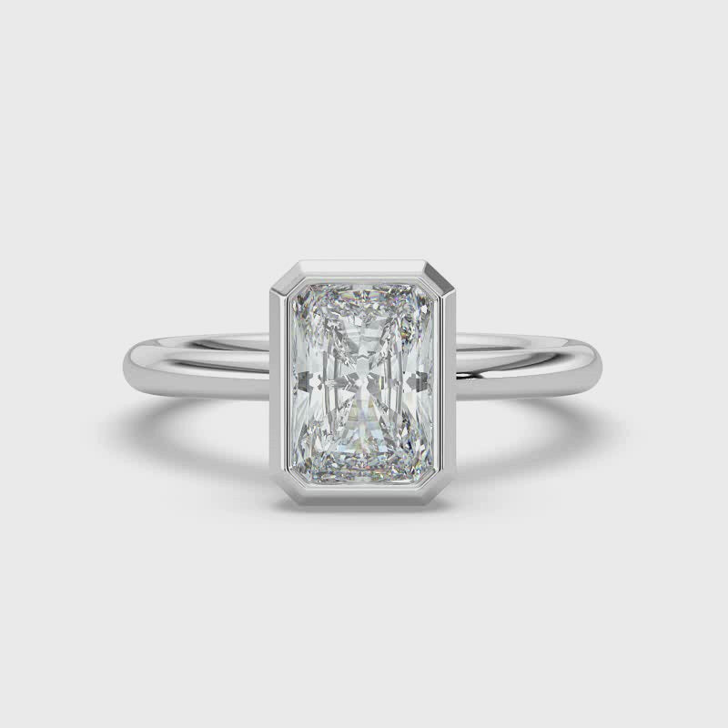 Emerald Bezel Set Solitaire Ring